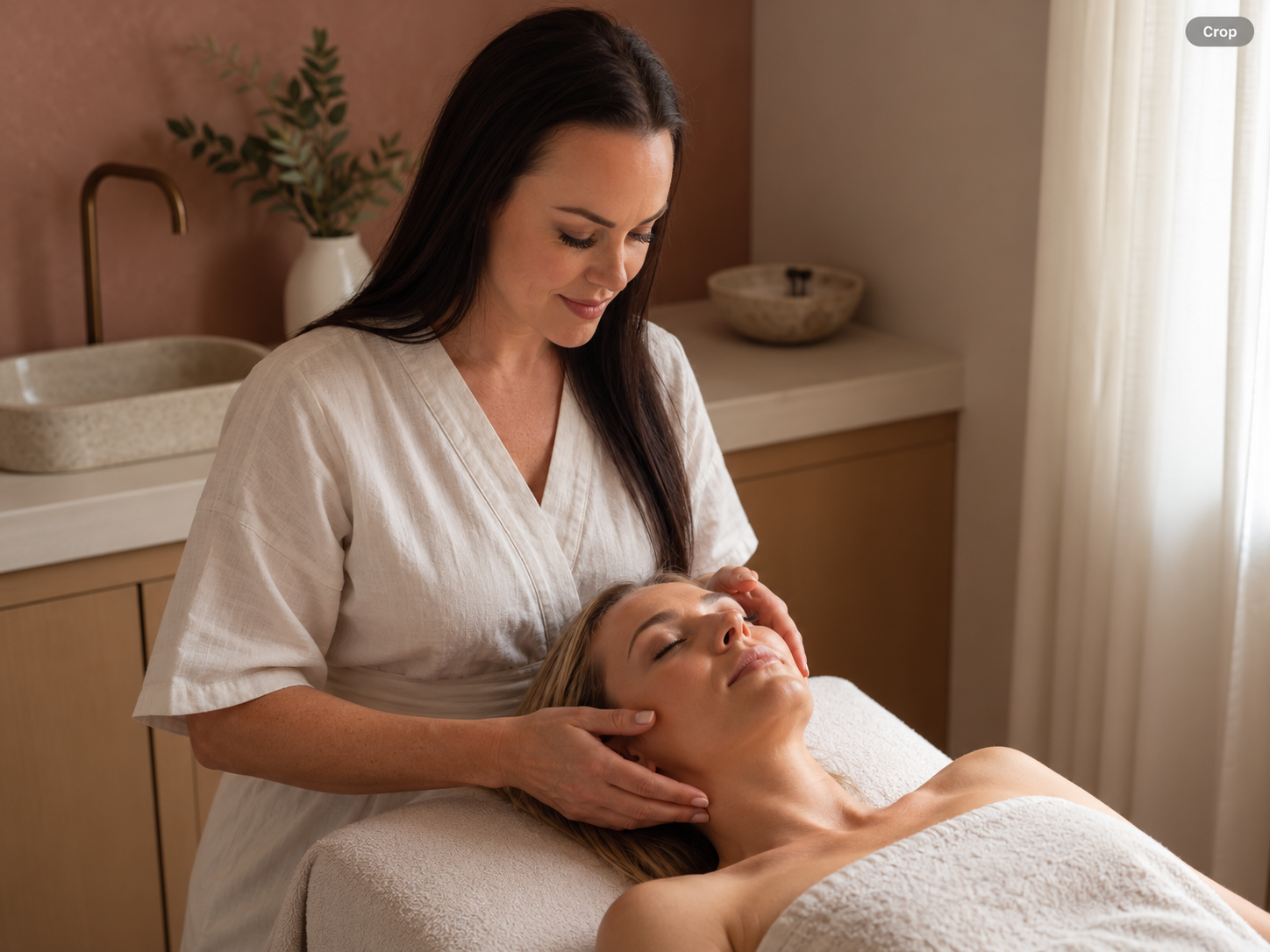 Chevonne performing a facial treatment on a client at Fundamental Skin in Tweed Heads